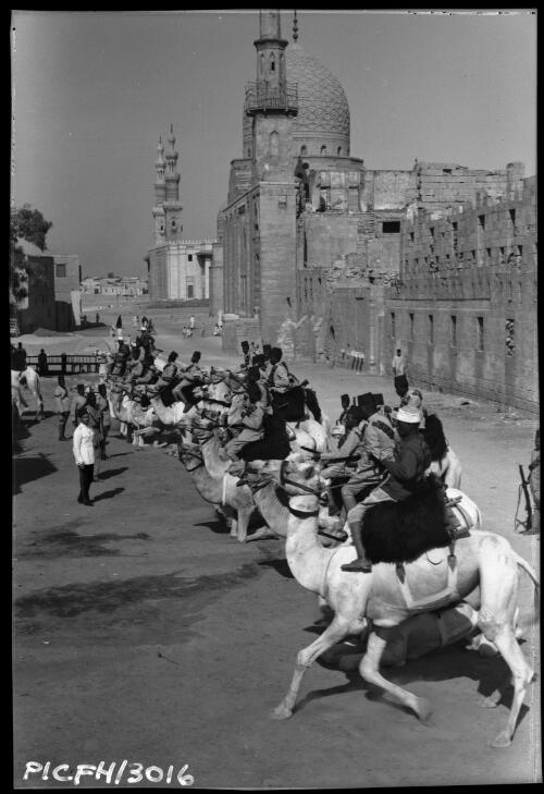 A Patrol of the Cairo police Camel Corps resting in front of the Mausoleum of Sultan Barsbay 1421 A.D. [1] [picture] : [Cairo, Egypt, World War II] / [Frank Hurley]