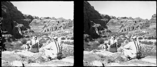 [Ampitheatre with two figures sitting on a high rock, Petra, 1943] [picture] : [Jordan, World War II] / [Frank Hurley]