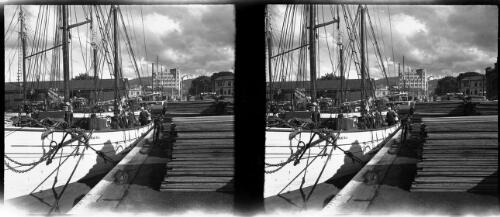 [Harbour in a town with boats, a figure and a jetty] [picture] : [Hobart, Tasmania] / [Frank Hurley]