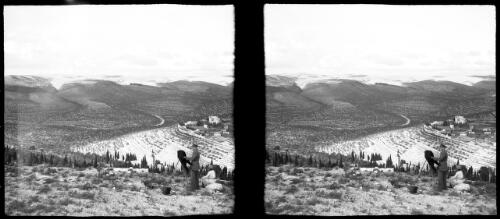Me [Frank Hurley] photographing on the height above Ain Karem looking towards the village of Koloura [picture] / [Frank Hurley]