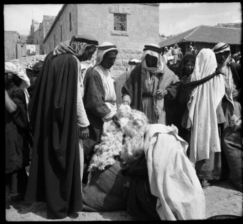[A group of figures in Arab dress, ca. 1942] [picture] / [Frank Hurley]