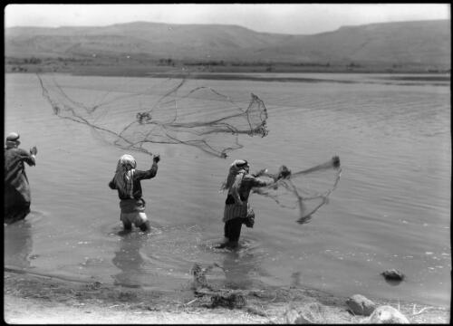 Arab fishermen casting nets Lake Huleh [picture] / [Frank Hurley]