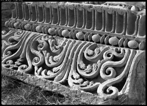 Just a detail of fine stone carving, a flower in stone, an inconspicuous detail but worked with a fineesse of a jeweller [Baalbek] [picture] : [Lebanon, World War II] / [Frank Hurley]