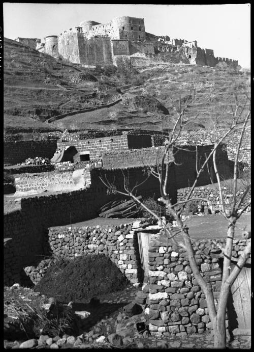 Crac de Chevalier Crusader Castle in mid-Syria [view of castle from below] [picture] / [Frank Hurley]