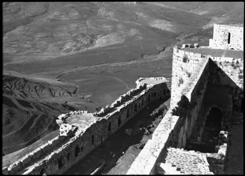 Battlements of the Crac-de-Chevalier Crusader stronghold Syria, also exterior view of this well-preserved Crusader Fortress [view from the fortress battlements] [picture] / [Frank Hurley]