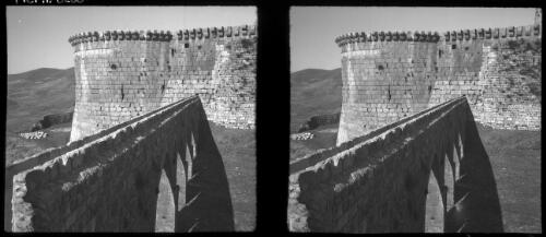 The Crac-de-Chevalier, one of the finest preserved of the Crusader fortresses in N. Syria [view of the castle walls and the round projecting towers which provided the Crusader garrison a wide range of defensive fire] [picture] / [Frank Hurley]