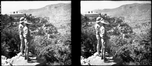 Syria [two standing figures, in uniform, looking out over valley, World War II] [picture] / [Frank Hurley]