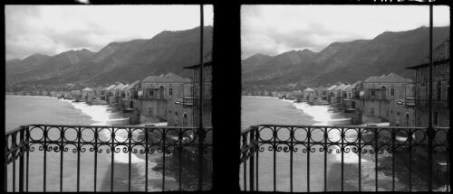 Stereos taken around the lovely villages of Juni [view from a balcony with iron fencing, World War II] [picture] / [Frank Hurley]