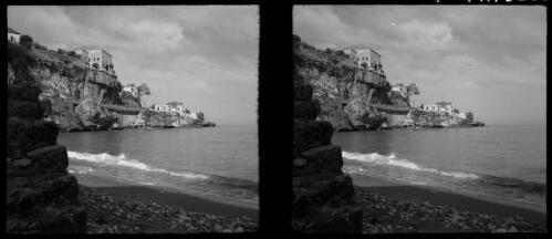 Stereos taken around the lovely villages of Juni [houses facing the sea, a small beach in the foreground, World War II] [picture] / [Frank Hurley]