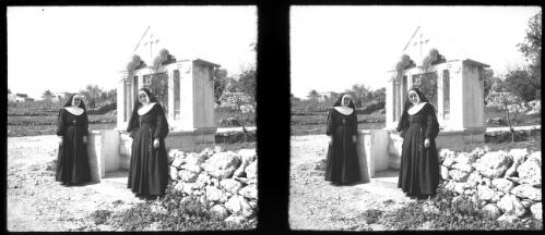 Shrine of Patron Saint, Saint George Jouneh pronounced (Junee) Syria [two nuns in front of the shrine, World War II] [picture] / [Frank Hurley]
