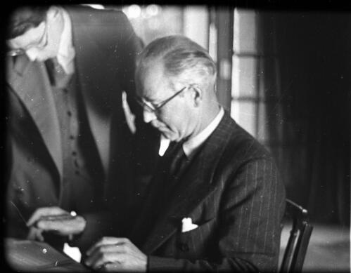 Modern Jerusalem, Government House & the Administrator Cunningham [General Sir Alan Gordon Cunningham (1887-1983), British High Commissioner to Palestine, seated at desk] [picture] / [Frank Hurley]