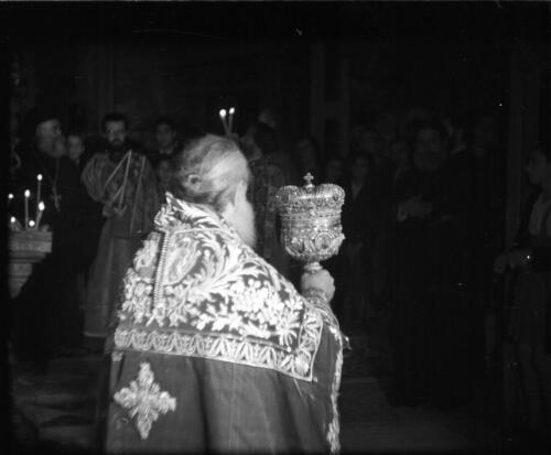 Greek Service in Holy Sepulchre [richly robed priest] [picture] / [Frank Hurley]