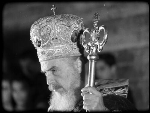 Greek Service in Holy Sepulchre [close-up of priest's richly decorated ceremonial crown and staff] [picture] / [Frank Hurley]