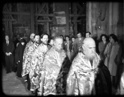 Greek Service in Holy Sepulchre [procession of priests in ceremonial robes] [picture] / [Frank Hurley]