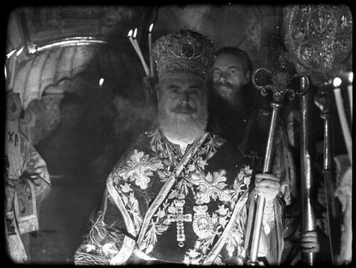 Greek Service in Holy Sepulchre [head priest fronts the procession] [picture] / [Frank Hurley]