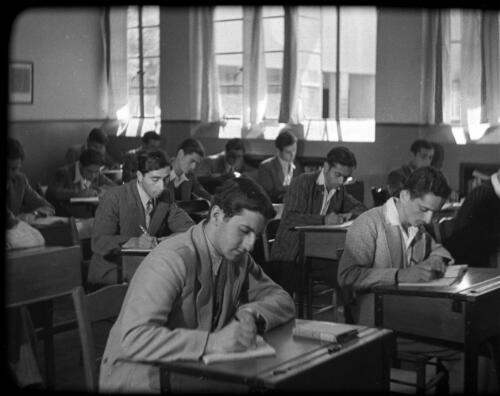 The Arabic College Jerusalem [classroom of students at their desks, 1] [picture] / [Frank Hurley]