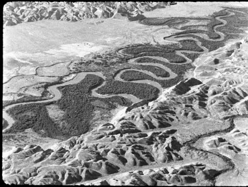 Aerial & other shots of the Jordan to the Baptismal site below Allenby Bridge [aerial view of the meandering Jordan River] [picture] / [Frank Hurley]