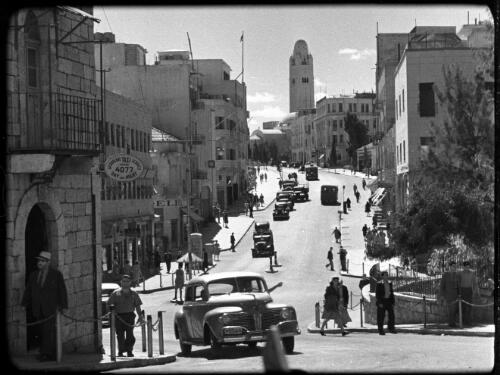 Modern streets & buildings Jerusalem [HaMelekh David Street, New City, with Jerusalem YMCA in the distance, 2] [picture] / [Frank Hurley]