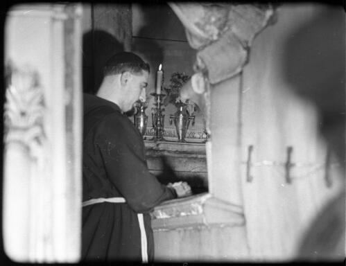 Opening shots in Church of Holy Sepulchre, Stone of Annointing Calvary [picture] / [Frank Hurley]