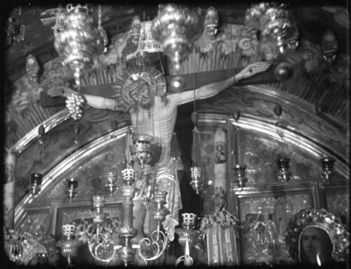 Opening shots in Church of Holy Sepulchre [detail of image of Jesus on the Cross, 12th Station of the Cross, Church of the Holy Sepulchre, Jerusalem, 1] [picture] / [Frank Hurley]