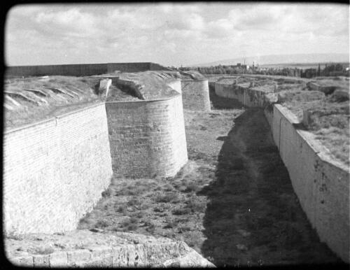 Ras Naqura, headland & Acre [possibly Al-Jazzars's wall, Akko, Palestine] [picture] / [Frank Hurley]