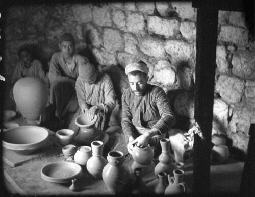 Making clay pottery & Alskelon ruins [picture] / [Frank Hurley]