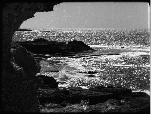 Athlit & Jewish village showing farmwork & school [seascape framed by ruins] [picture] / [Frank Hurley]