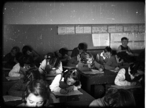 Athlit & Jewish village showing farmwork & school  [classroom scene with children busy at study] [picture] / [Frank Hurley]-