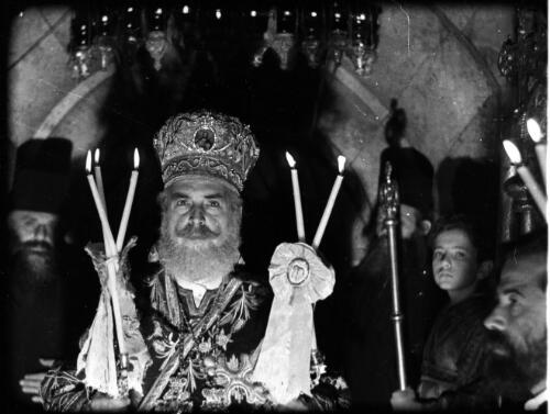 [Priest with candles, Church of the Holy Sepulchre, Jerusalem, 1] [picture] / [Frank Hurley]