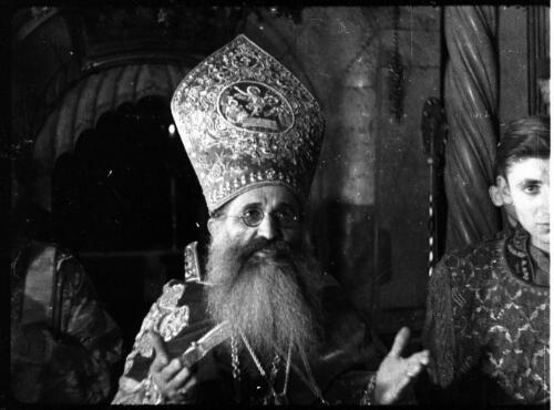[Priest in a gesture of prayer, Church of the Holy Sepulchre, Jerusalem, 1] [picture] / [Frank Hurley]