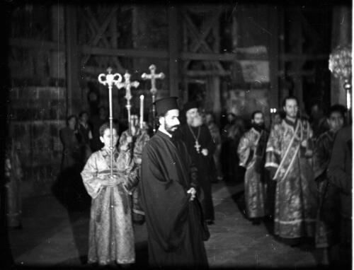 [Armenian priests and altar boys in procession, Church of the Holy Sepulchre, Jerusalem] [picture] / [Frank Hurley]