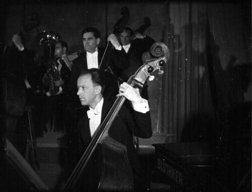 [Three double bass players, 1] [picture] / [Frank Hurley]
