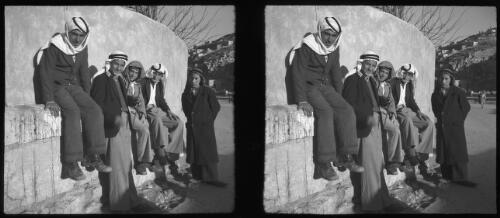Peeps in Amman, stereos, capital Transjordania [four men sitting and one standing pose for shot, all wearing Arab headdress] [picture] : [Jordan] / [Frank Hurley]