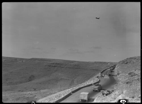 Sollum Pass [Allied military vehicles in convoy, ca. 1940-1946] [picture] : [Barqah, Libya] / [Frank Hurley]