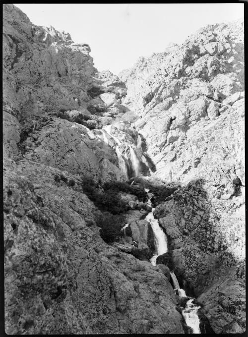 Village & waterfall in mountains near Teheran [the waterfall] [picture] : [Iran, World War II] / [Frank Hurley]