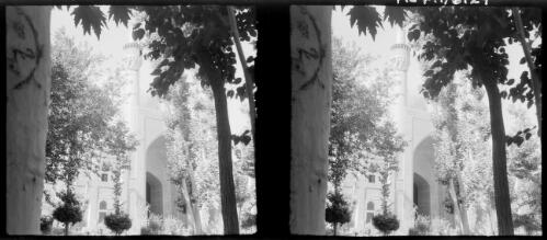 Isfahan [Madresseh Shah Hossien-religious college seen through the trees, Isfahan, Persia] [picture] : [Iran, World War II] / [Frank Hurley]