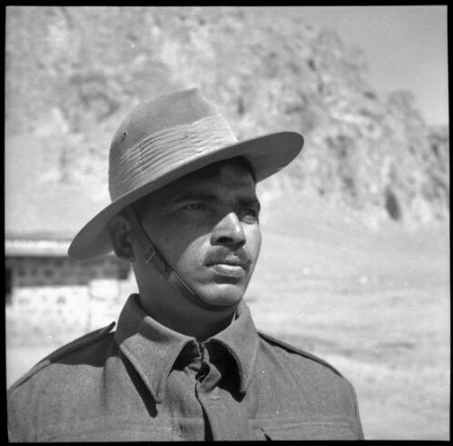 [Close up portrait of male with distinctive uniform and hat, World War II] [picture] : [Iran] / [Frank Hurley]