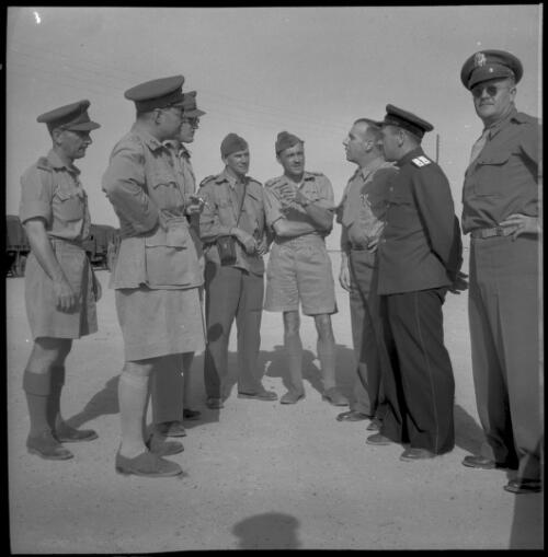[Close up of eight variously ranked, standing military personnel, World War II] [picture] : [Iran] / [Frank Hurley]