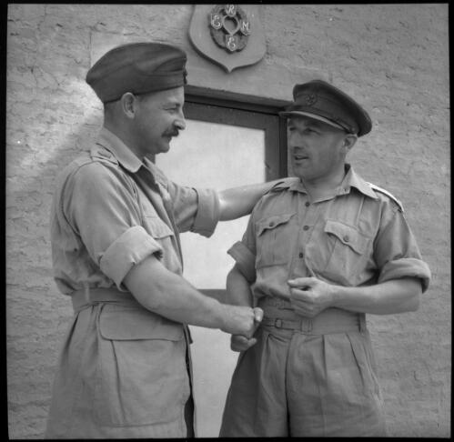 [Close up of two male personnel shaking hands, World War II] [picture] : [Iran] / [Frank Hurley]