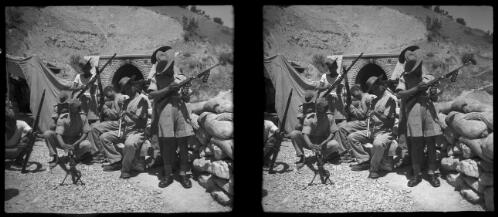 Scenes on the Persian Railroad near Durud [male personnel checking weapons, World War II] [picture] : [Iran] / [Frank Hurley]