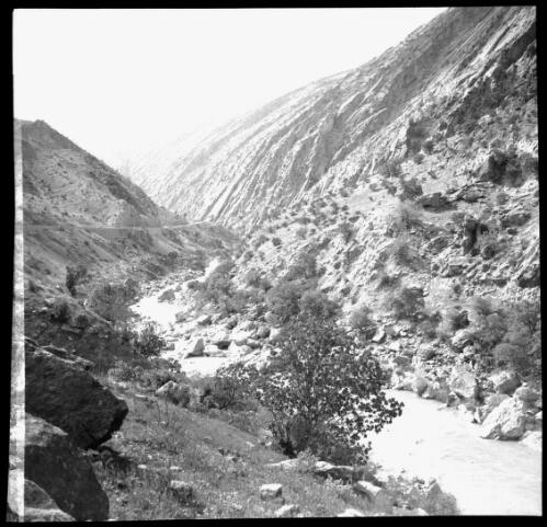 Sunday shots, Iran [valley, river, road and rocky barren mountains, World War II] [picture] : [Iran] / [Frank Hurley]