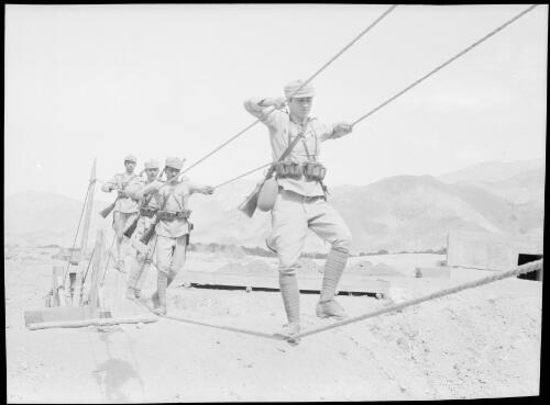 Persian Infantry crossing rope bridge [picture] : [Iran, World War II] / [Frank Hurley]