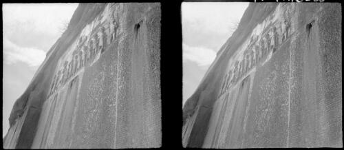 Famous rock carvings at Beisitun on mountain face near Kermanshah Persia [looking up to the carving, World War II] [picture] : [Iran] / [Frank Hurley]