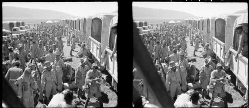 Indians leave camp near Karind Persia [soldiers between rows of trucks, World War II] [picture] : [Iran] / [Frank Hurley]