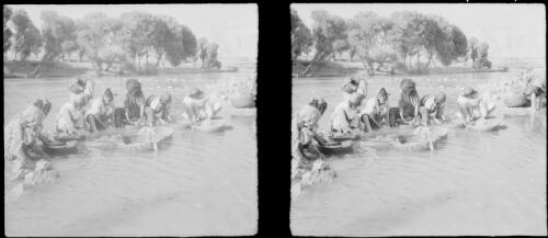 Wool scouring in river at Kermanshah, the wool is used for carpet making [World War II] [picture] : [Iran] / [Frank Hurley]