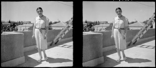 [Woman on a balcony, a ladder behind her] [picture] : [Iran, World War II] / [Frank Hurley]