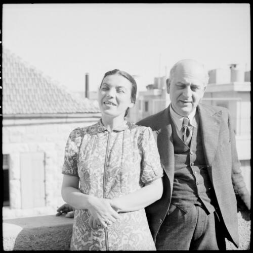 [Portrait of a man and a woman, leaning on a balcony wall. ] [picture] : [Iran, World War II] / [Frank Hurley]