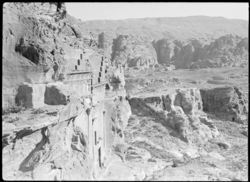 Petra valley [tomb foreground on left, valley behind ca. 1940-1946] [picture] : [Petra Valley, Jordan] / [Frank Hurley]