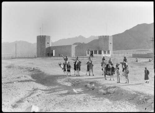 [Stone fort with Arab Legionnaires and camels in front, ca. 1940-1946, 2] [picture] : [Petra Valley, Jordan] / [Frank Hurley]