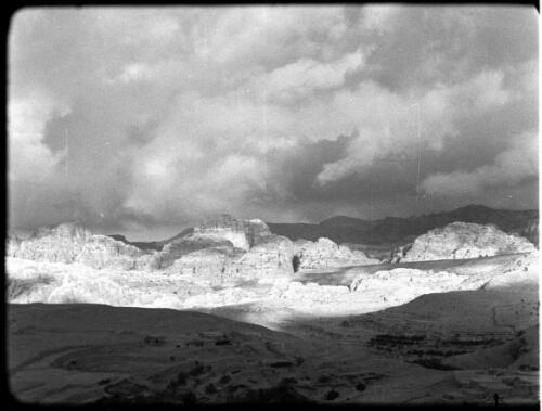 Petra [terraced hill, mountains and clouds ca. 1940-1946] [picture] : [Petra Valley, Jordan] / [Frank Hurley]